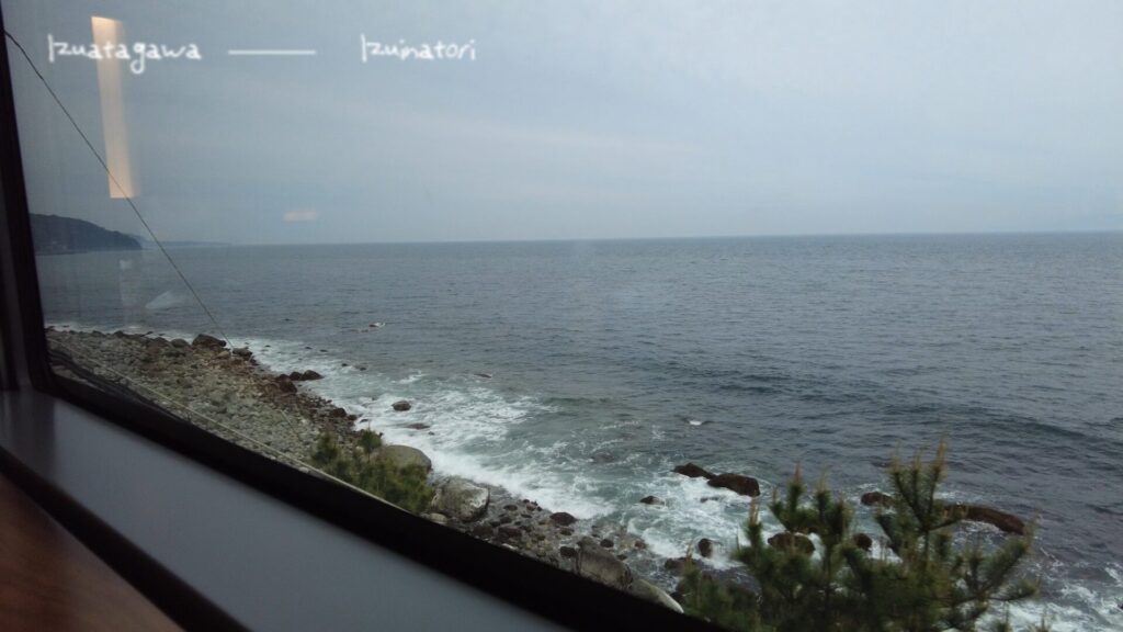 Window of a train running on the last minute of an overseas flight